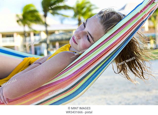 13 year old girl resting in hammock
