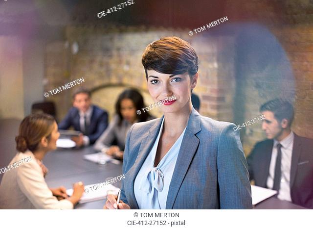Portrait confident businesswoman in conference room meeting