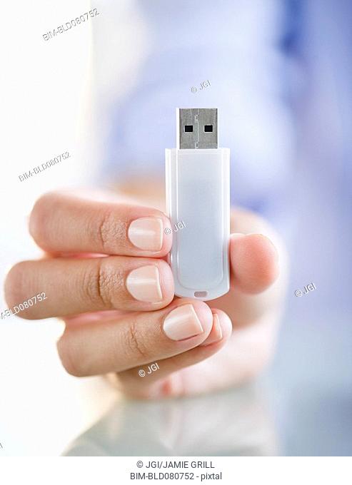 Hand holding USB stick