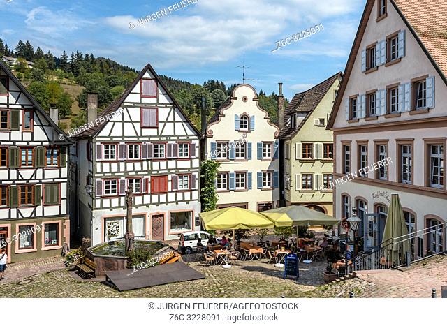 old houses of Schiltach, Black Forest, Germany, market place of the historical town with well and pavement café and half timbered-houses