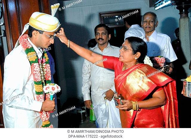 Women blessing bridegroom  ; Nattukottai Chettiar  ; Nagarathar Community ; Chettinad  ; Tamil Nadu MR777K ;777A