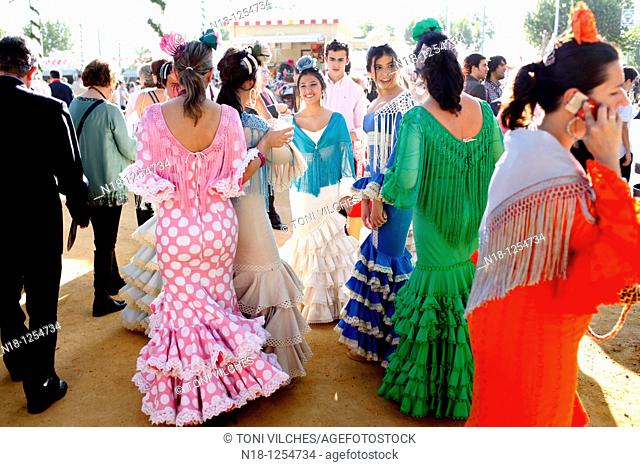 Abril, 20, 2010 Spain Seville April Fair. A crowd of people attend today the first real day of the 'feria de Abril' of Seville Many women dresses with the...