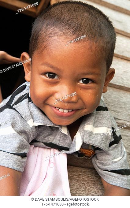 Sulu refugee boy with a big smile on Mabul Island, Borneo, Malaysia