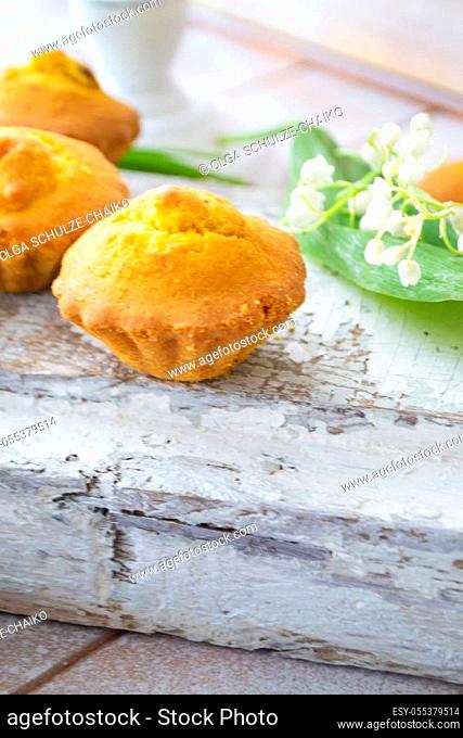 Bran muffins or cupcakes with raisin, vintage shabby background, vertical image