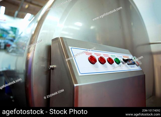 Industrial stainless steel tank for milk and other beverages is shown at a food and drink exhibition