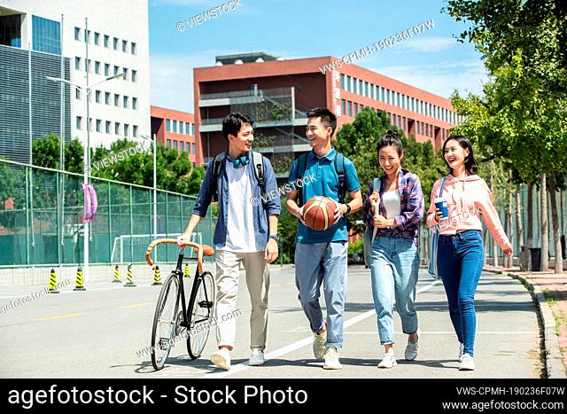 Happiness of college students walking in the campus