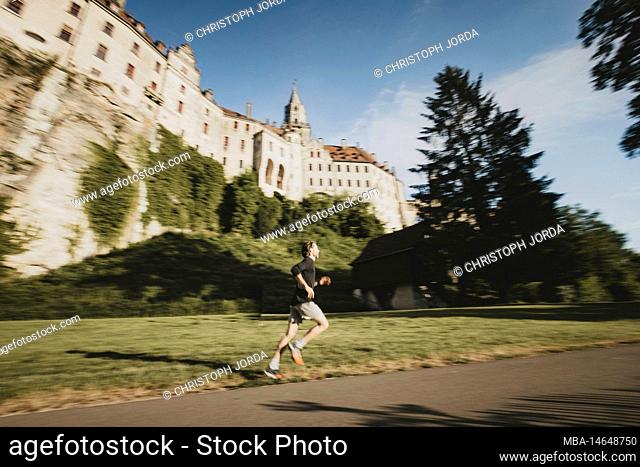 Germany, Baden-Wuerttemberg, Sigmaringen, Hohenzollern castle, man, jogging