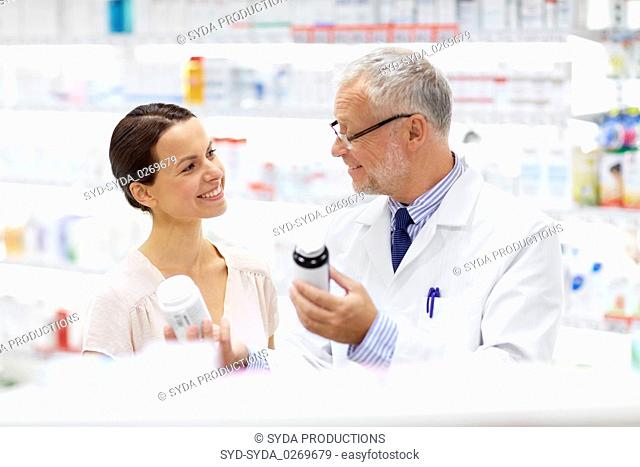 apothecary and woman with drug at pharmacy