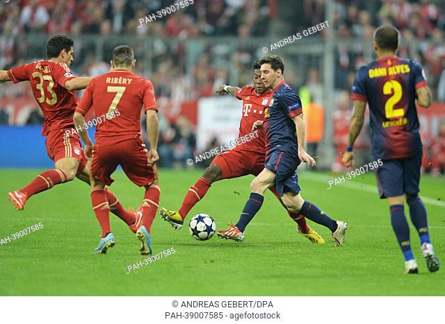 Munich's Mario Gomez (L), Franck Ribéry, David Alaba and Barcelona's Lionel Messi vie for the ball during the UEFA Champions League semi final first leg soccer...
