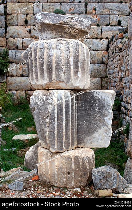 Parts of old column in ruins of Ephesus, Turkey