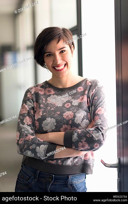 portrait of young businesswoman in casual hipster clothes at modern startup business office interior