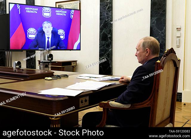 RUSSIA, MOSCOW - MAY 16, 2023: Russia's President Vladimir Putin and Amur Region Governor Vasily Orlov hold a meeting via video link from the Moscow Kremlin