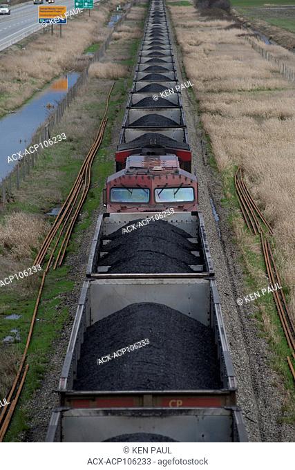 A CP (Canadian Pacific) coal train in Delta, British Columbia Canada nears its terminus of Roberts Bank Superport