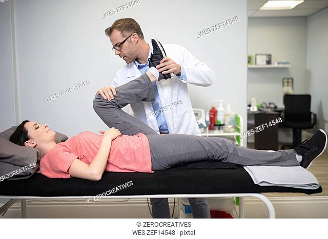 Doctor examiming patient in medical practice