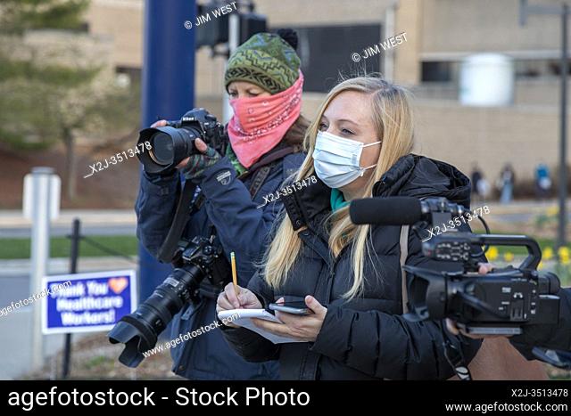 Ann Arbor, Michigan - A reporter and photographer do an interview during the coronavirus pandemic. They talked with University of Michigan hospital nurses who...