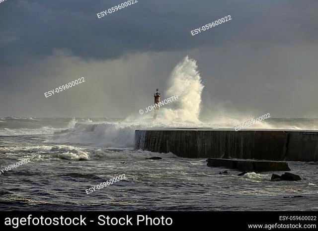 Ave river mouth, Vila do Conde, north of Portugal, during storm. End of the day light