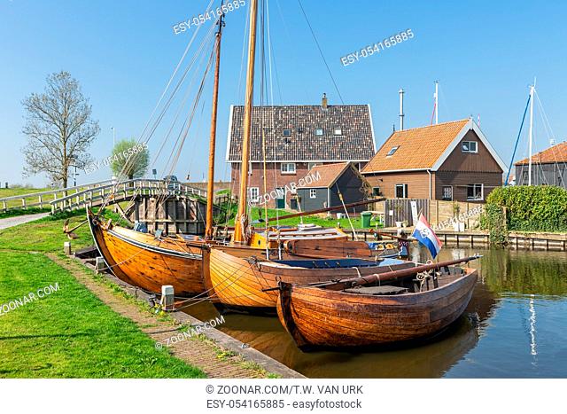 Historical ships and fishing vessels anchored in harbor Dutch fishing village Workum