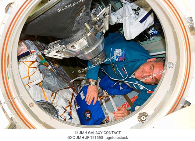 Russian cosmonaut Alexander Skvortsov, Soyuz commander and Expedition 23 flight engineer, is pictured in the Soyuz TMA-18 spacecraft after the hatches between...
