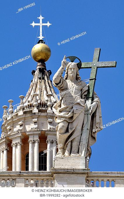 Statue of Jesus holding a cross above the colonnades, Basilica of Saint Peter, St. Peter's Basilica, Vatican City, Rome, Latium region, Italy, Europe