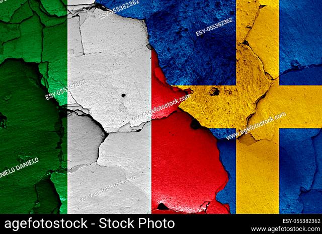 flags of Italy and Sweden painted on cracked wall