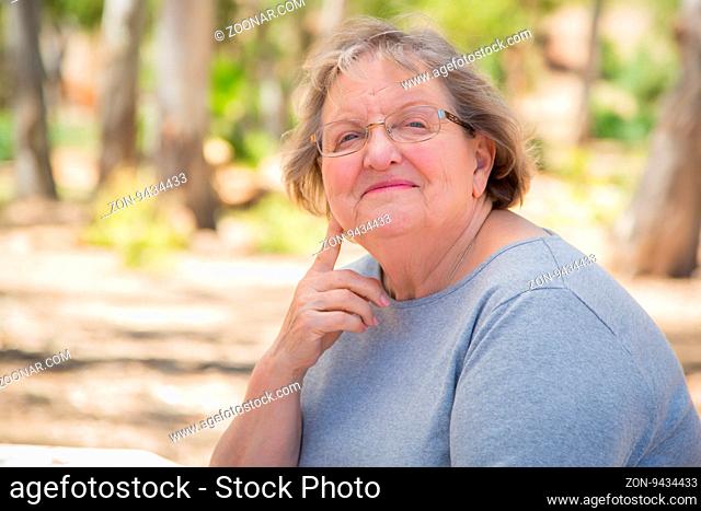 Happy Content Senior Woman Portrait Outdoors At Park