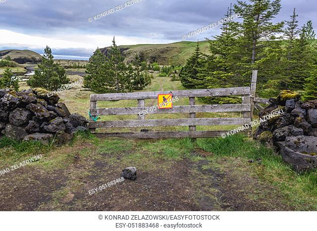 No pooping sign on a wooden gate in Iceland