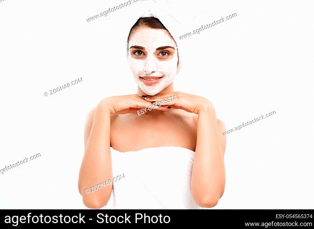 Beauty Skin Care Concept - Beautiful Caucasian Woman Face Portrait applying cream mask on her facial skin white background