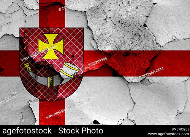 flag of Ventspils painted on cracked wall