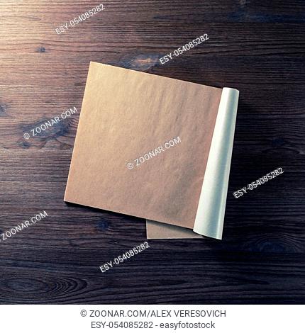 Notebook or booklet with blank pages on wooden background. Top view. Flat lay