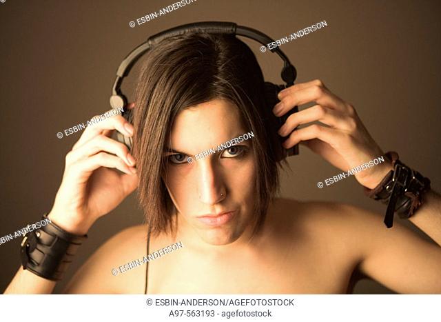Portrait of handsome teen boy wearing headset