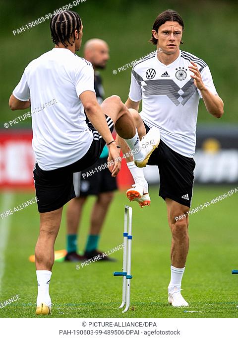 03 June 2019, Netherlands, Venlo: Leroy Sané (l) and Nico Schulz train with the national team in the De Koel stadium. The national football team plays against...