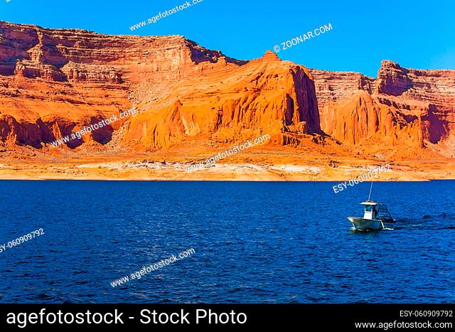 Tour on a pleasure boat on an artificial reservoir Lake Powell. Grandiose cliffs - red sandstone outcroppings. The Colorado River, USA