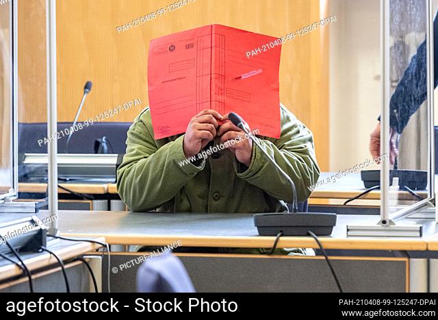 08 April 2021, Bavaria, Regensburg: The defendant sits in the hearing room at the regional court. The 37-year-old is alleged to have killed his six-year-old...