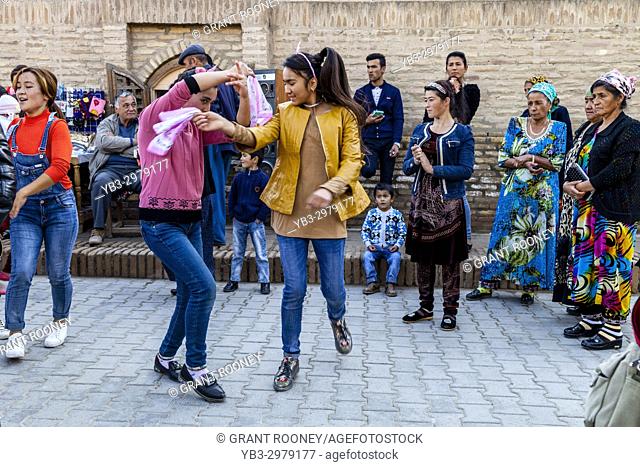 Young Uzbek People Dancing In The Street, Khiva, Uzbekistan