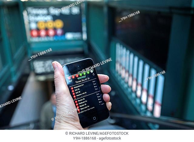 A subway rider checks the new MTA Subway Time app outside the Times Square station in New York Using the technology that is the engine behind the widely popular...