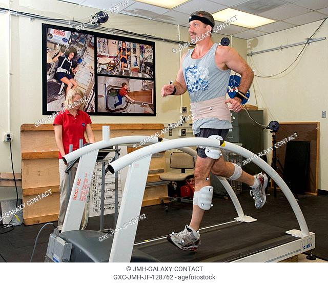 NASA astronaut Dan Burbank, Expedition 29 flight engineer and Expedition 30 commander, participates in a treadmill kinematics baseline data collection session...