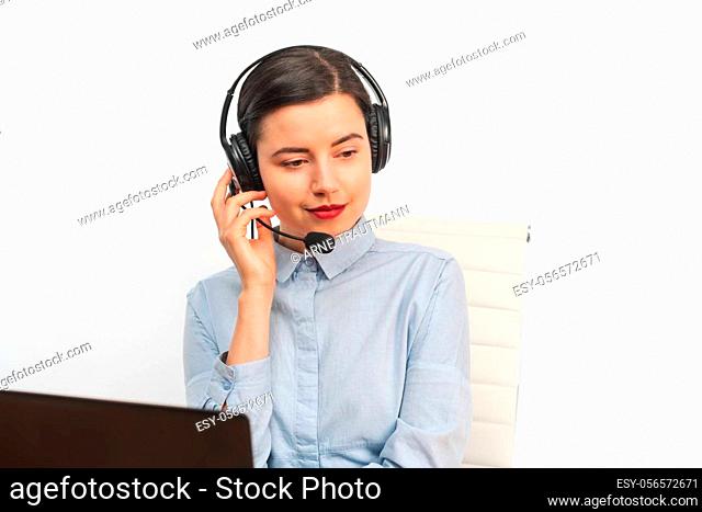 Portrait of a businesswoman working with headphone and laptop
