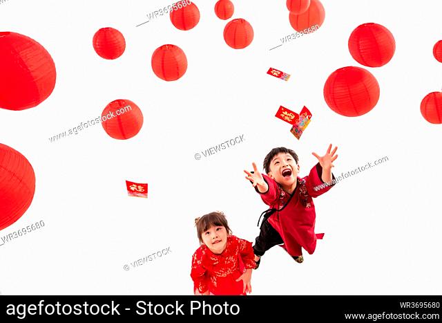 Boys and girls hand pick up a red envelope under red lanterns