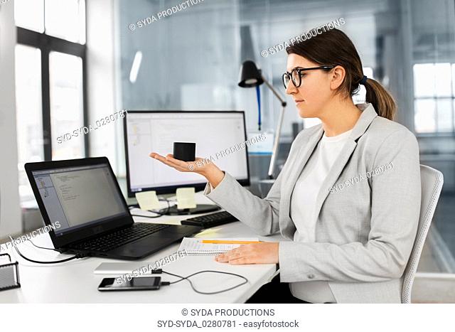 businesswoman using smart speaker at office