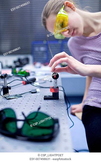 female scientist doing research in a quantum optics lab
