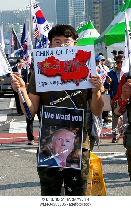 Hundreds of South Koreans march in Seoul as leaders of North and South Korea meet at a border village to discuss the US-North Korea summit