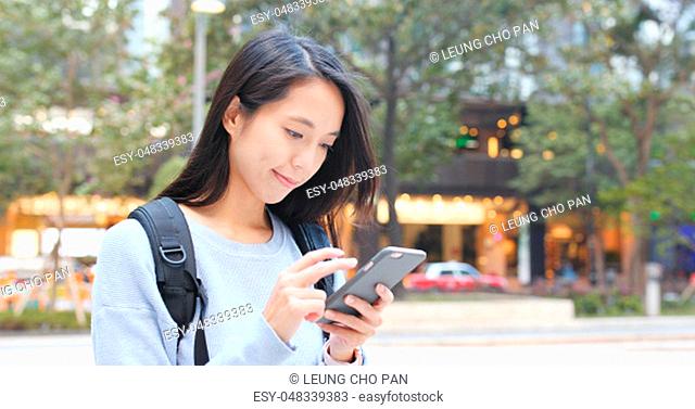 Woman use of mobile phone at outdoor