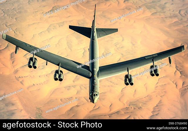 A U. S. Air Force B-52 Stratofortress assigned to the 2nd Bomb Wing departs after receiving fuel from a KC-135 Stratotanker assigned to the 340th Expeditionary...
