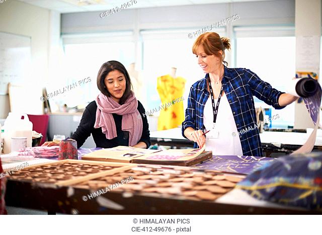 Female fashion designers working in studio