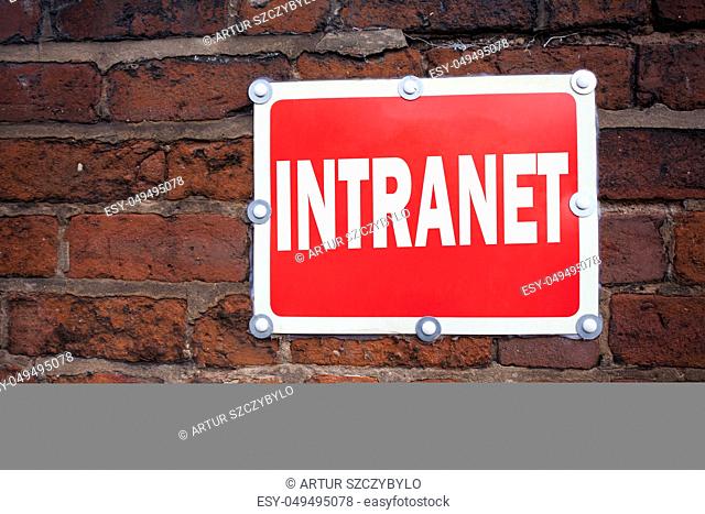 Hand writing text caption inspiration showing Intranet word cloud concept meaning Internet Network Technology written on old announcement road sign with...