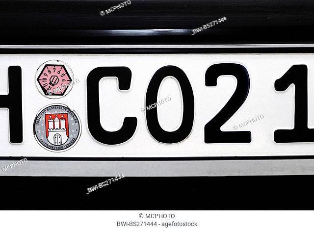 number plate with CO2 label and emissions test badge