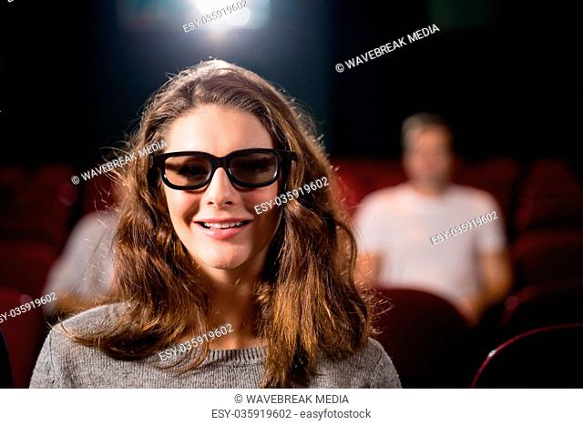 Woman watching movie in theatre