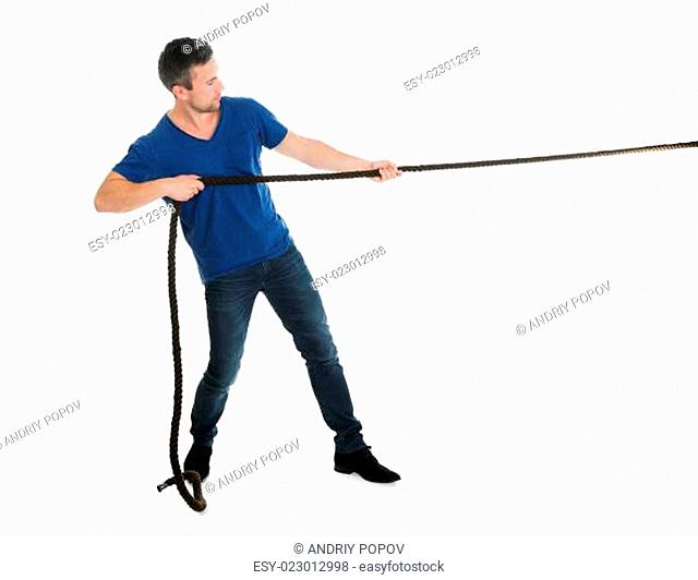 Portrait Of A Man Pulling Rope