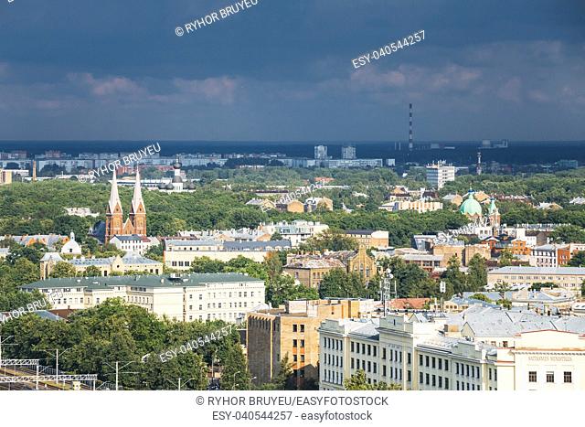 Riga, Latvia. Aerial Cityscape In Sunny Summer Day. Top View Of Landmarks - St. Francis Church, Ministry Of Transportation And All Saints Church