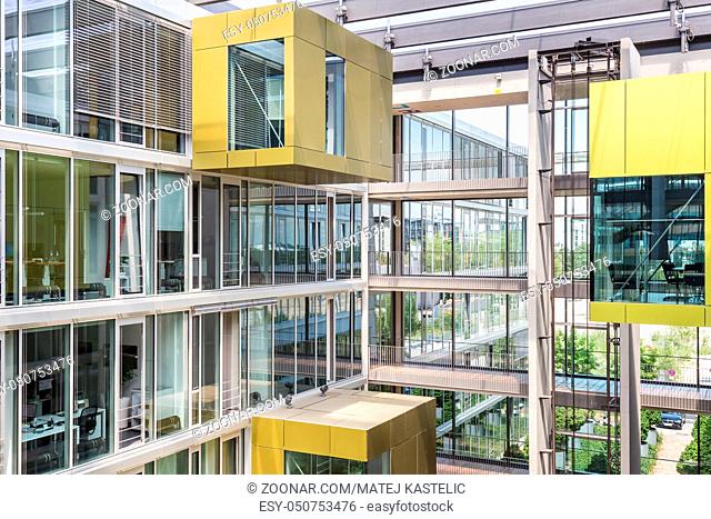 Main hall, staircase and windows of morden office building. Contemporary corporate business architecture. Munich Trading and Technology Centre